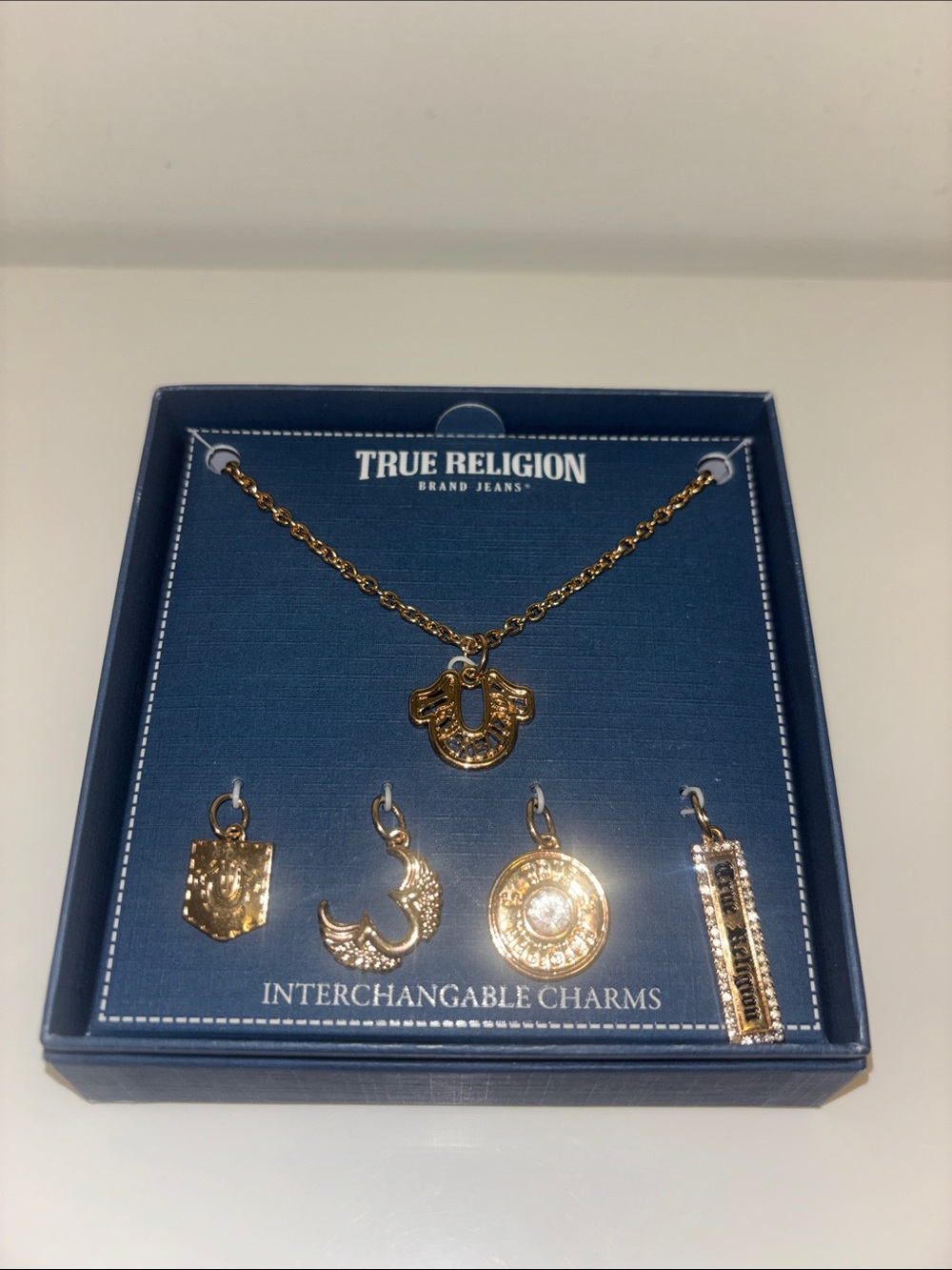 True Religion Gold Interchangeable Charm Necklace with Five Charms